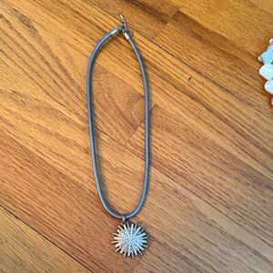 Elegant Silver Necklace with Starburst Pendant